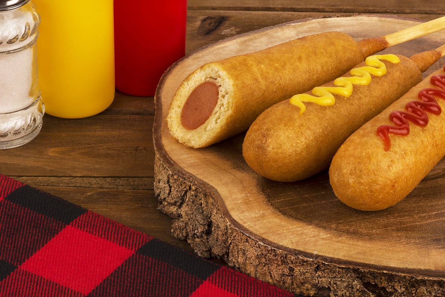 Group of Corn Dogs on a Wooden Table